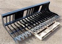 Lot 5037 - Skid Steer Rock Bucket, new.  Absentee bidding available on this item. Click catalog tab for more information & pictures.