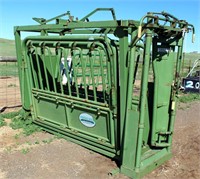 Lot 5008- Powder River Cattle Squeeze Chute   Absentee bidding available on this item. Click catalog tab for more information & pictures.