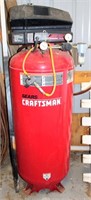 Lot 5012 - Craftsman Upright Air Compressor, Click catalog tab to view information & more pics of this item.  This item has absentee bidding.